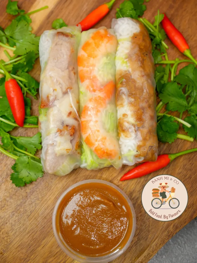 Mixed rice paper rolls with fresh herbs and dipping sauce
